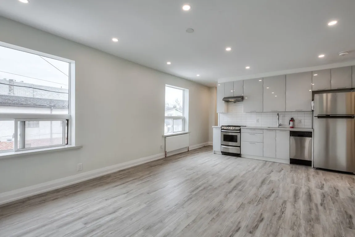 living room with hardwood floors overlooking kitchen