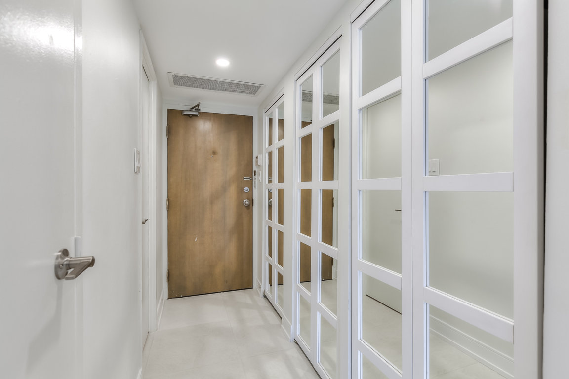 apartment entrance with mirrored closets