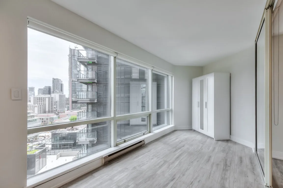 bedroom with floor to ceiling windows