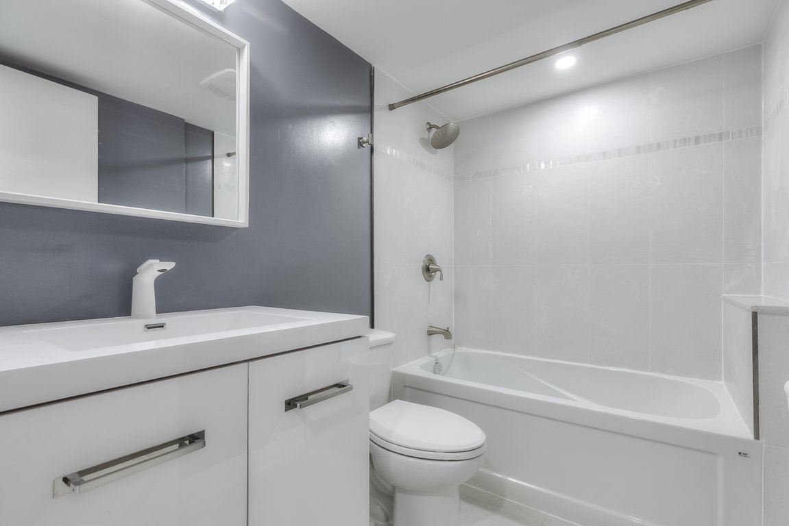 bathroom vanity, toilette and tub