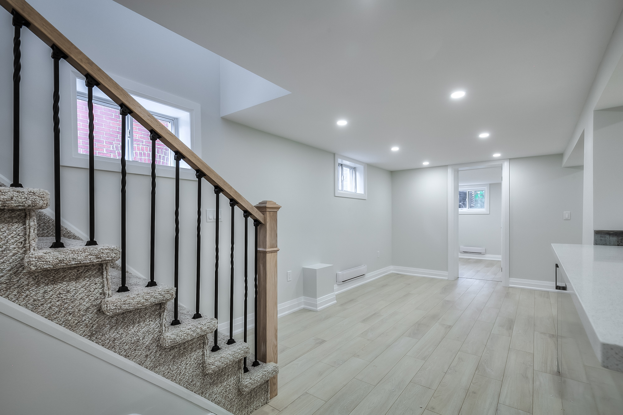 stairs leading down to finished basement living room