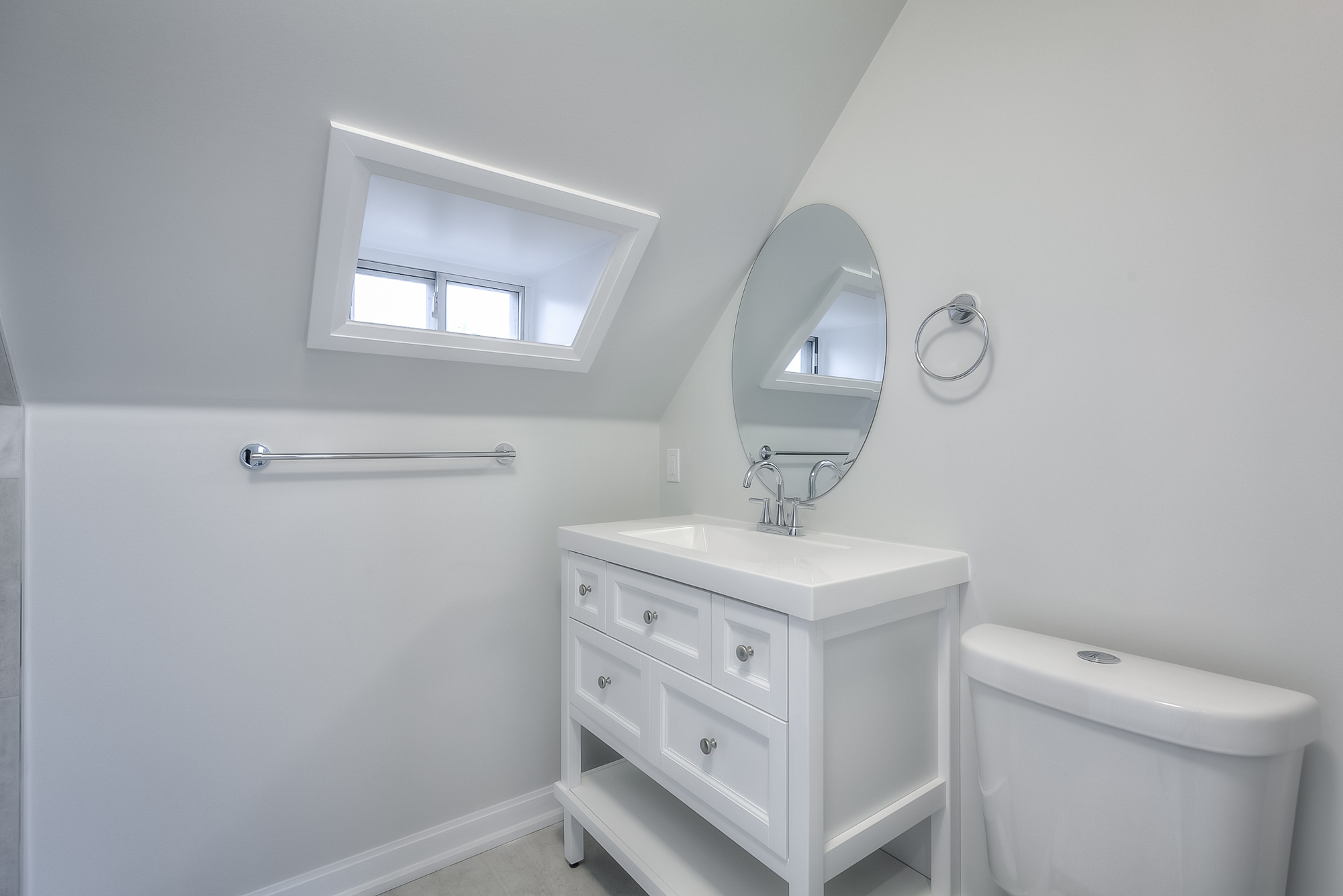bathroom with vanity and toilette