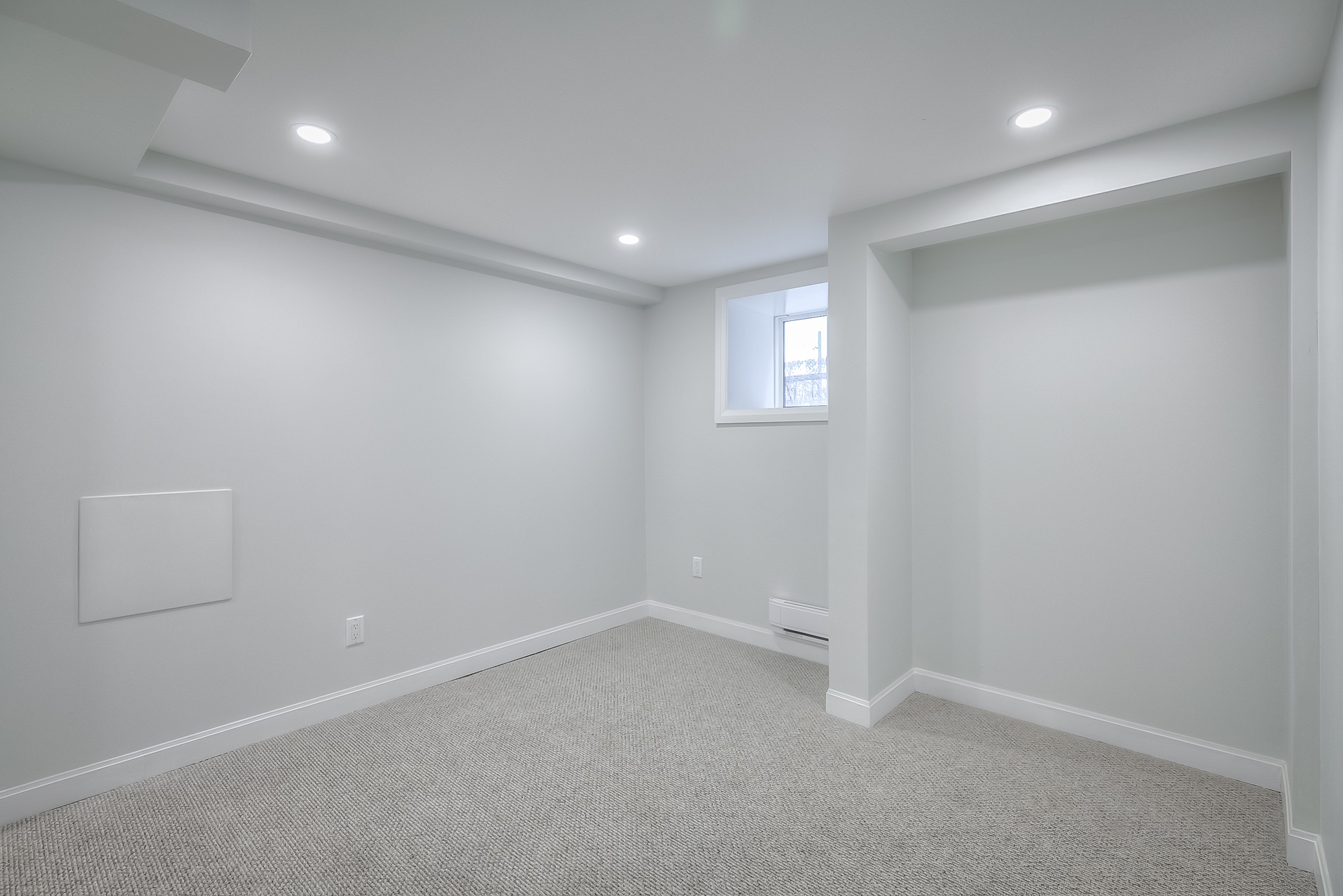 bedroom with white walls and carpet