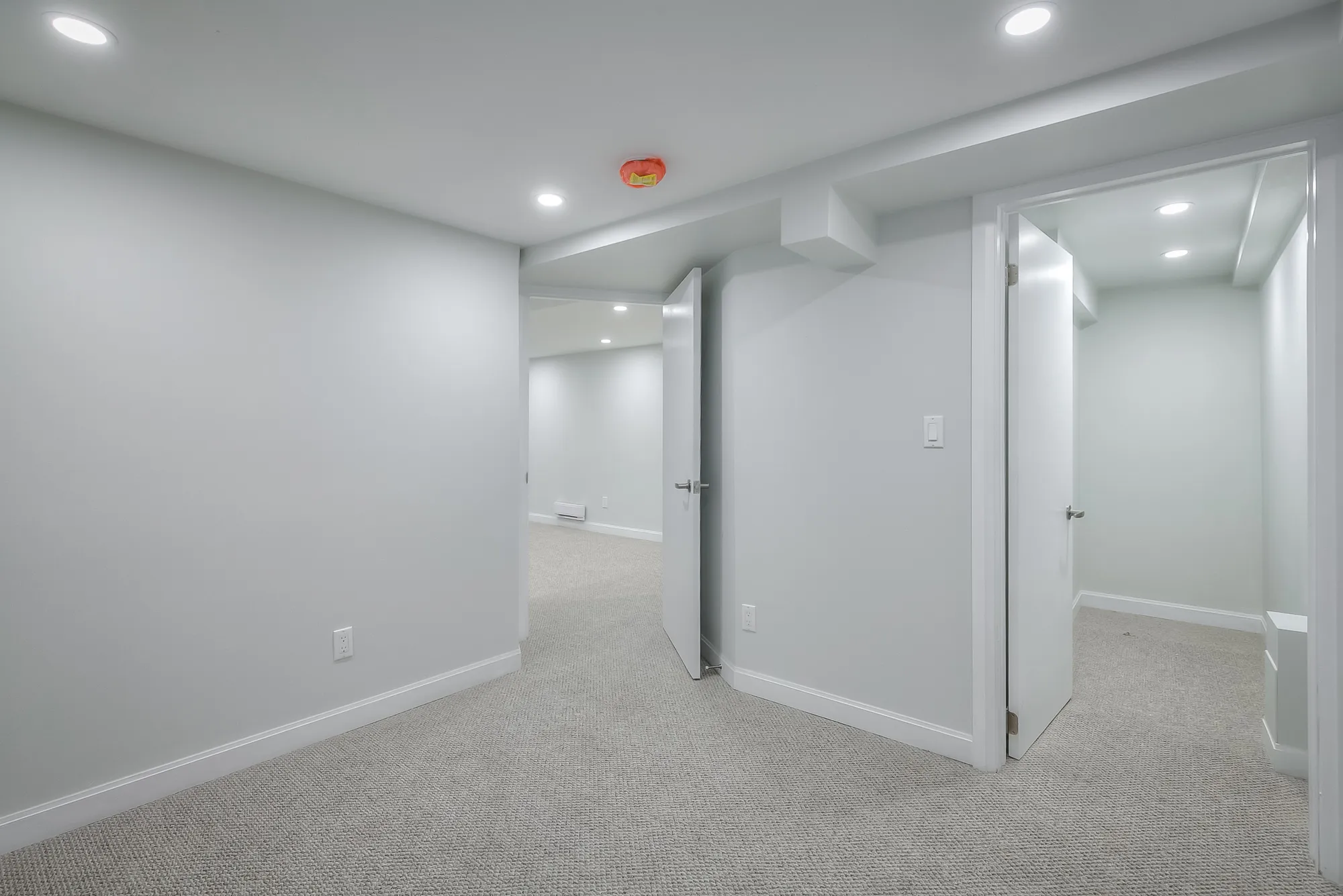 bedroom with white walls and carpet