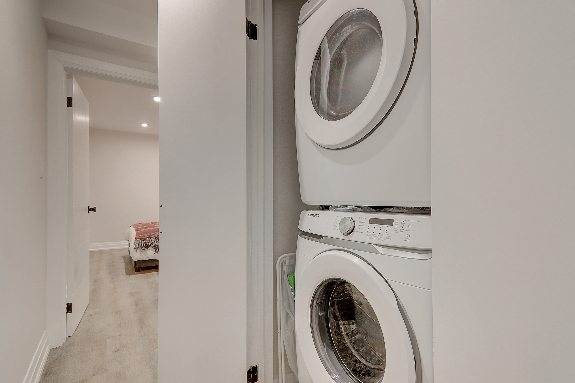 A washing machine and dryer in a room