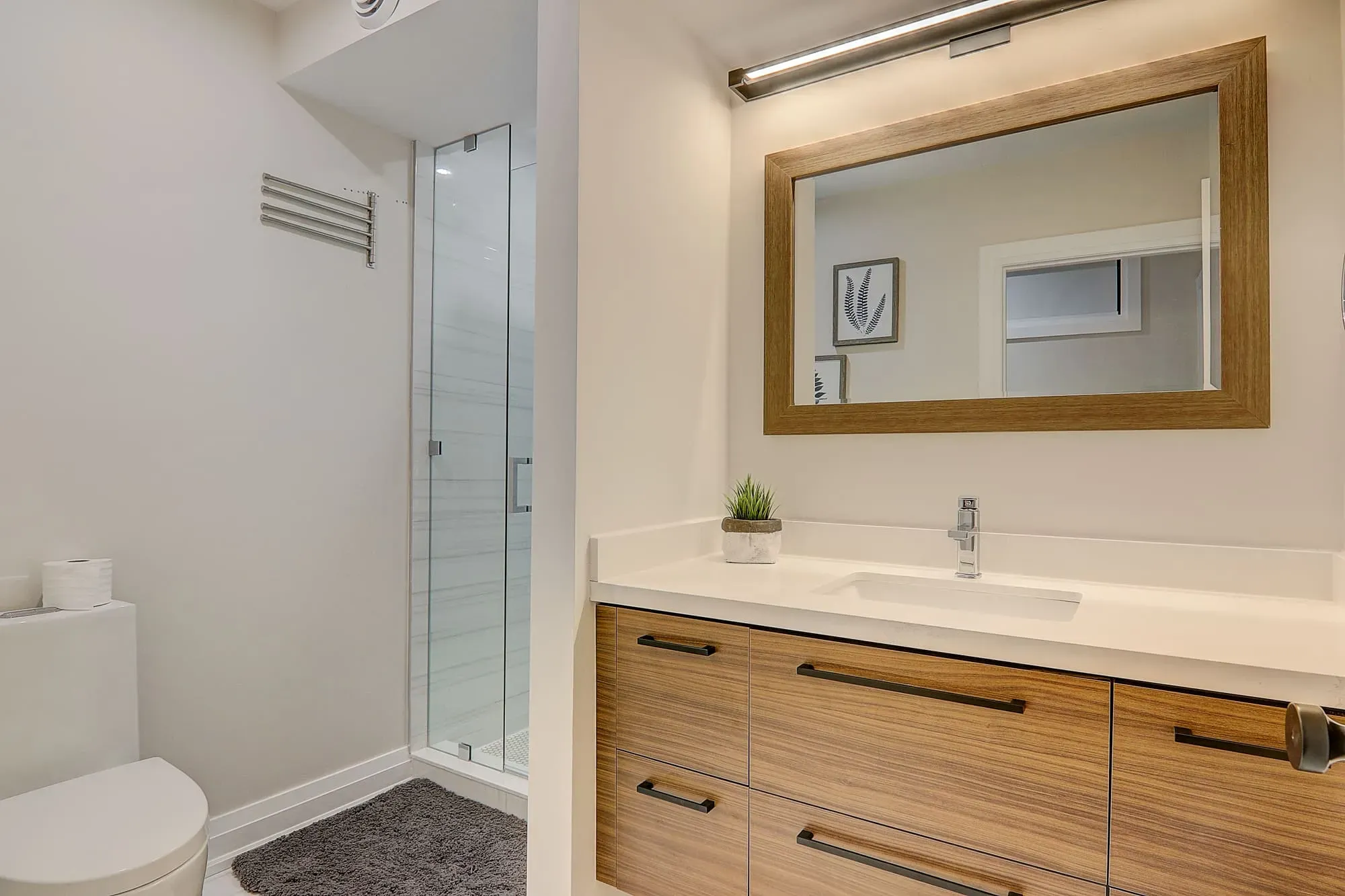 A bathroom with a mirror and sink