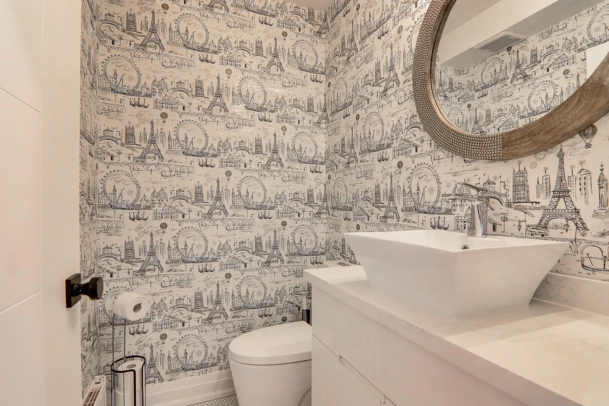 A bathroom with a mirror and sink