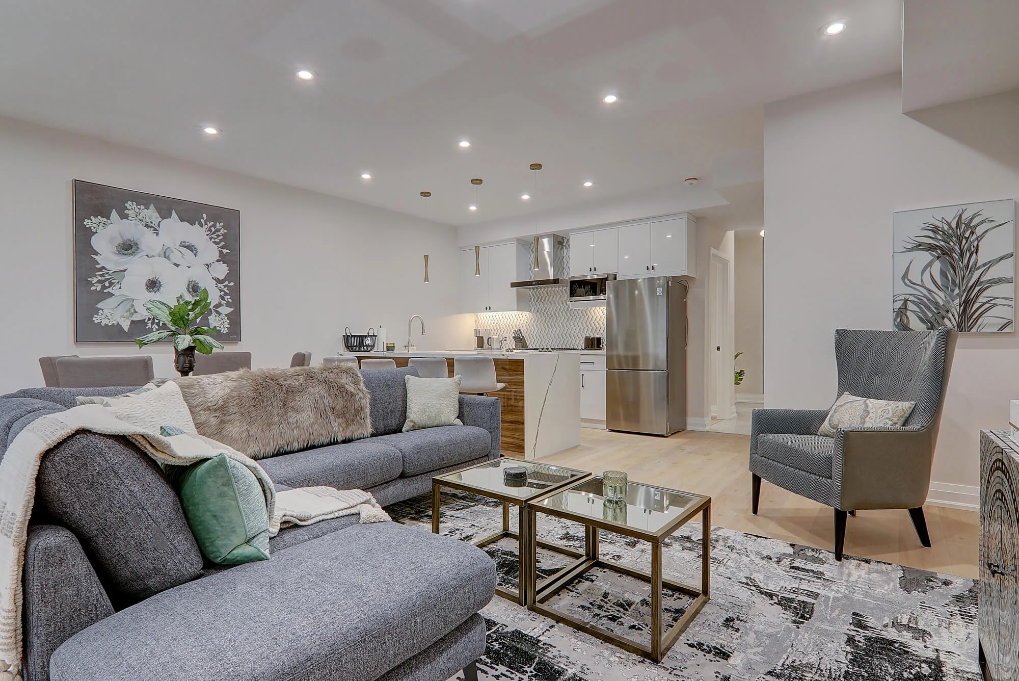 A living room with a couch and a rug