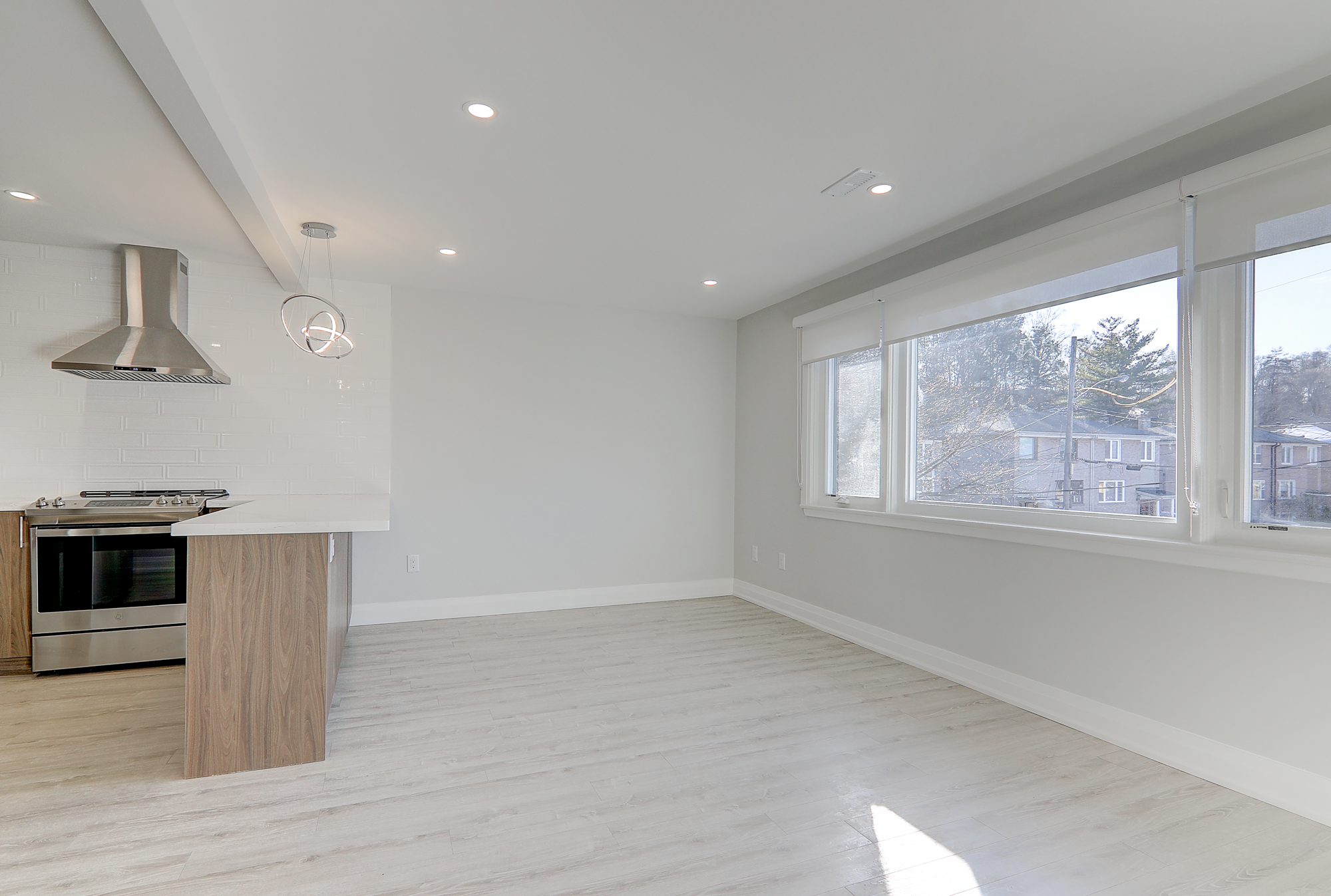 A room with white walls and a wood floor