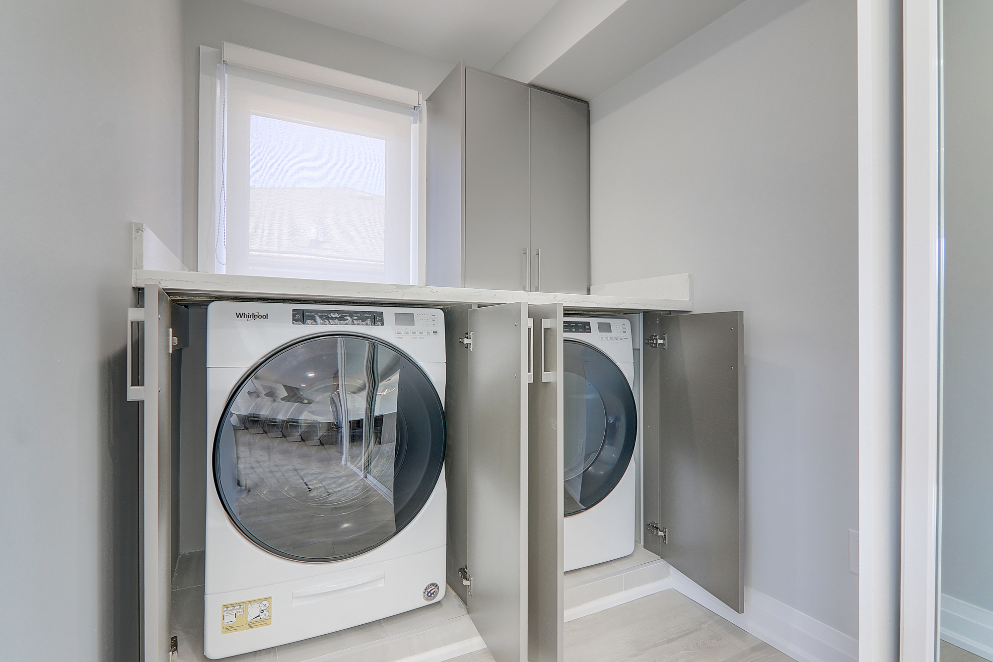 A washer and dryer in a laundry room