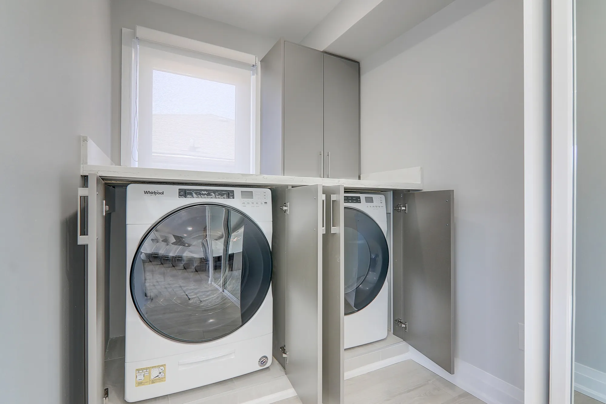 A washer and dryer in a laundry room