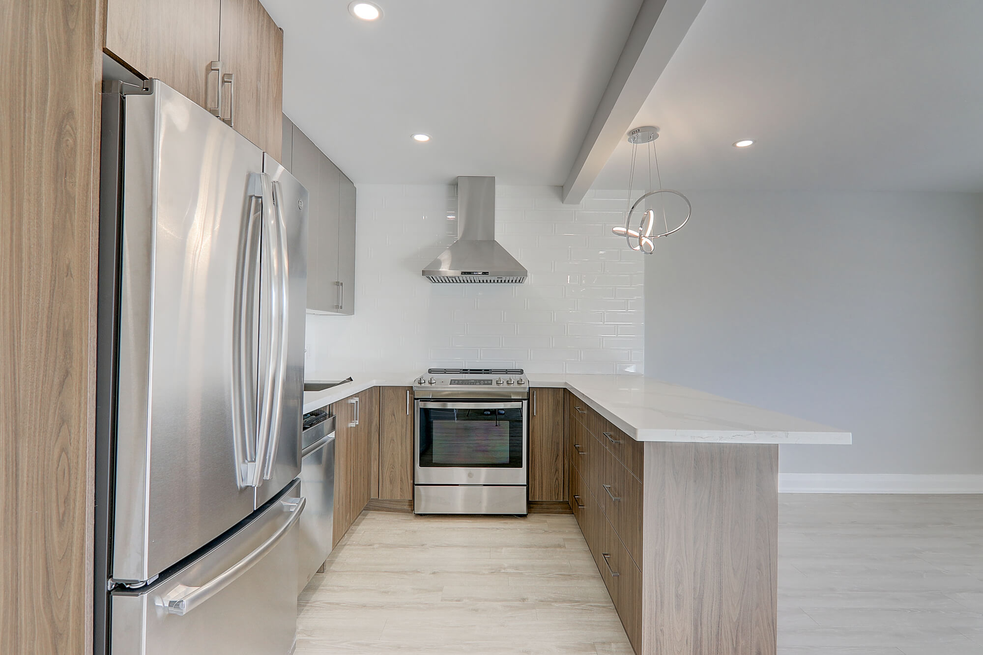 A kitchen with a white counter top