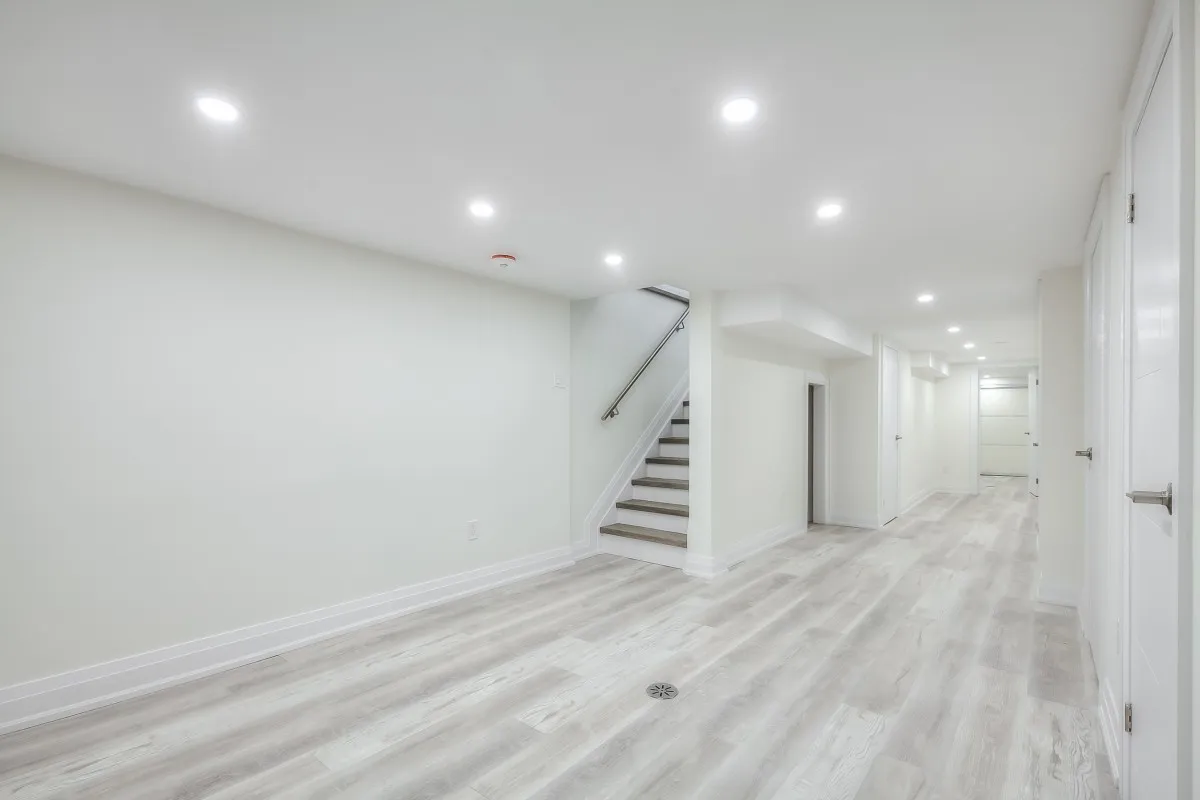 A white room with stairs and a staircase