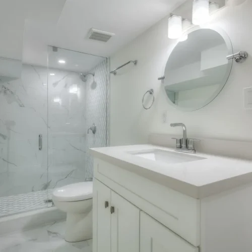 A bathroom with a mirror and a shower