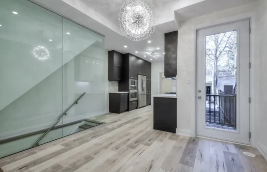 A kitchen and dining room with glass doors