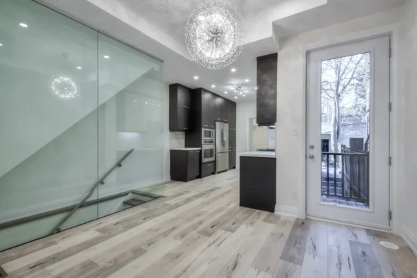 A kitchen and dining room with glass doors