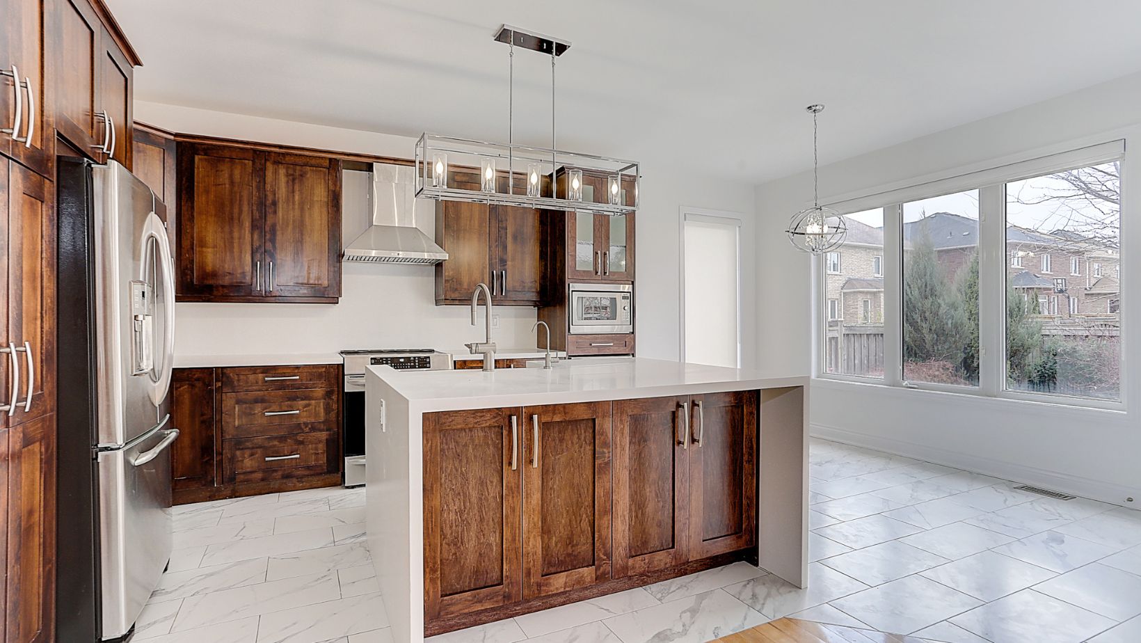 Kitchen of a house with wood cabinets and a kitchen island