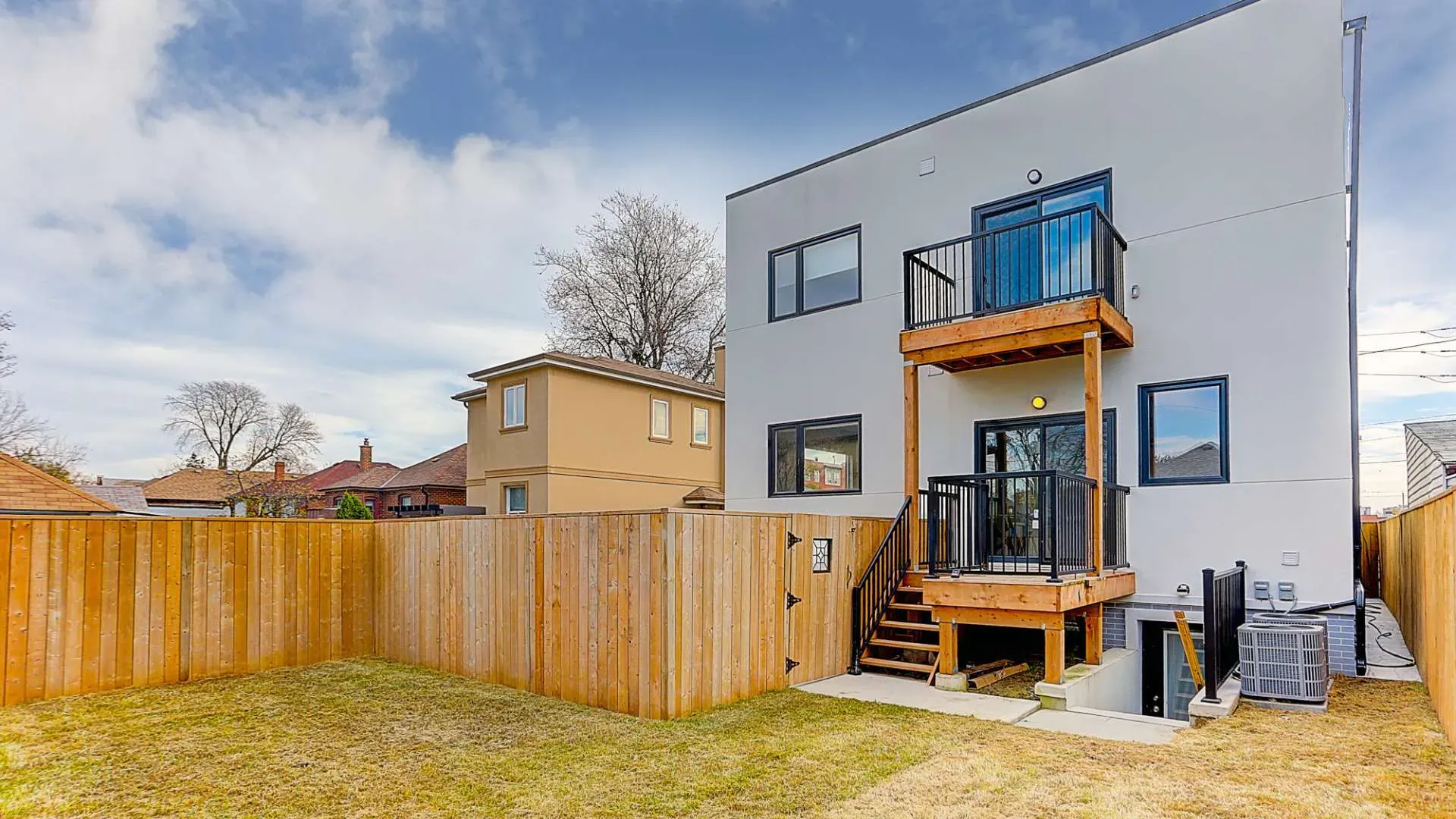 The backyard view of a fourplex property in Toronto