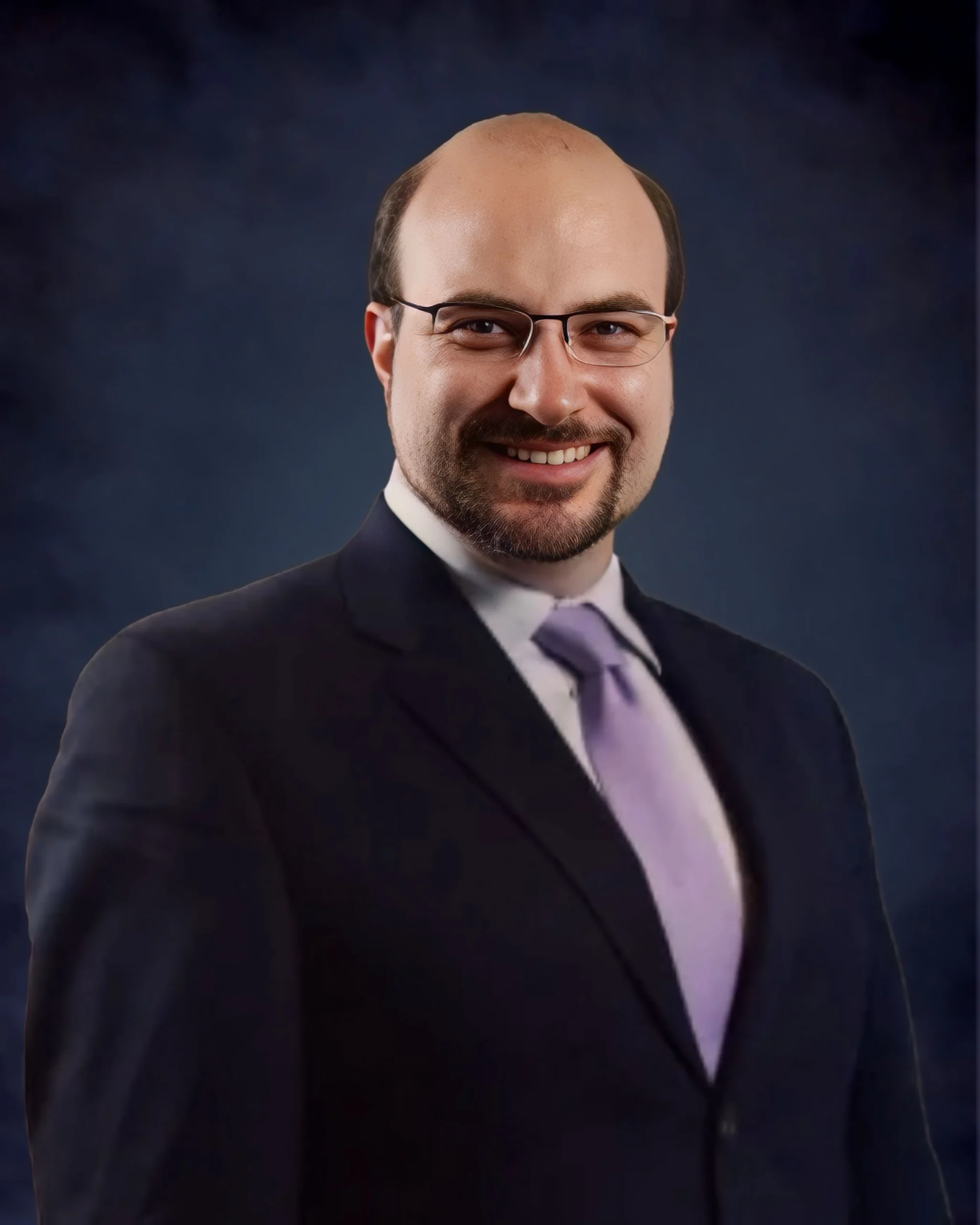 Professional headshot of Devon, member of the real estate team.