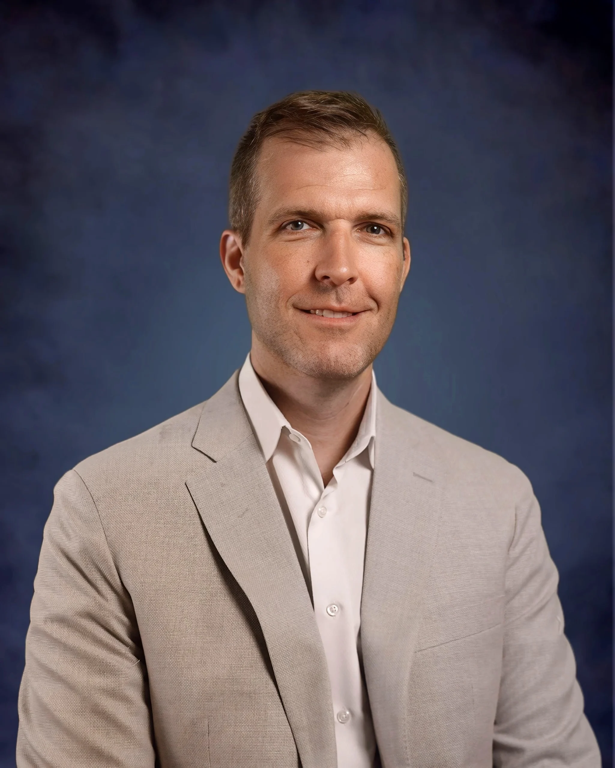 Professional headshot of Brandon, member of the real estate team.