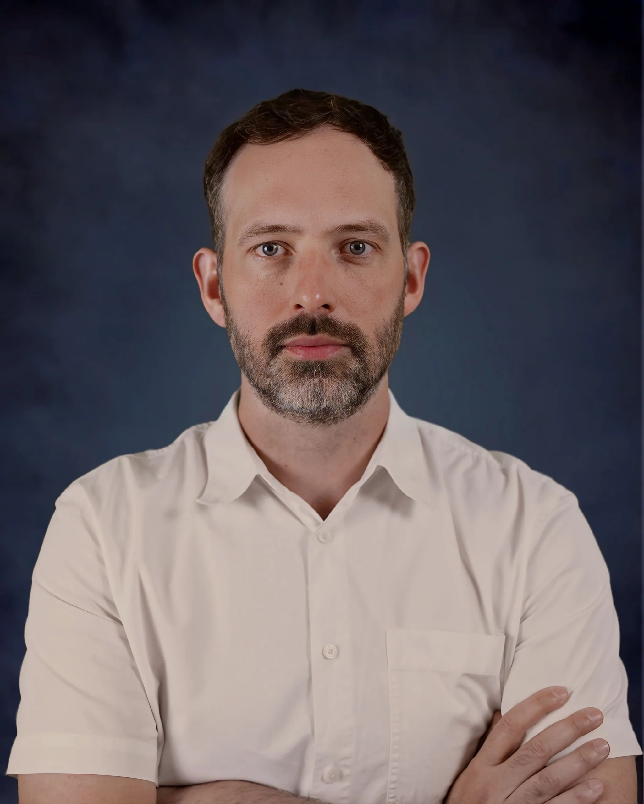 Professional headshot of Brian, member of the real estate team.