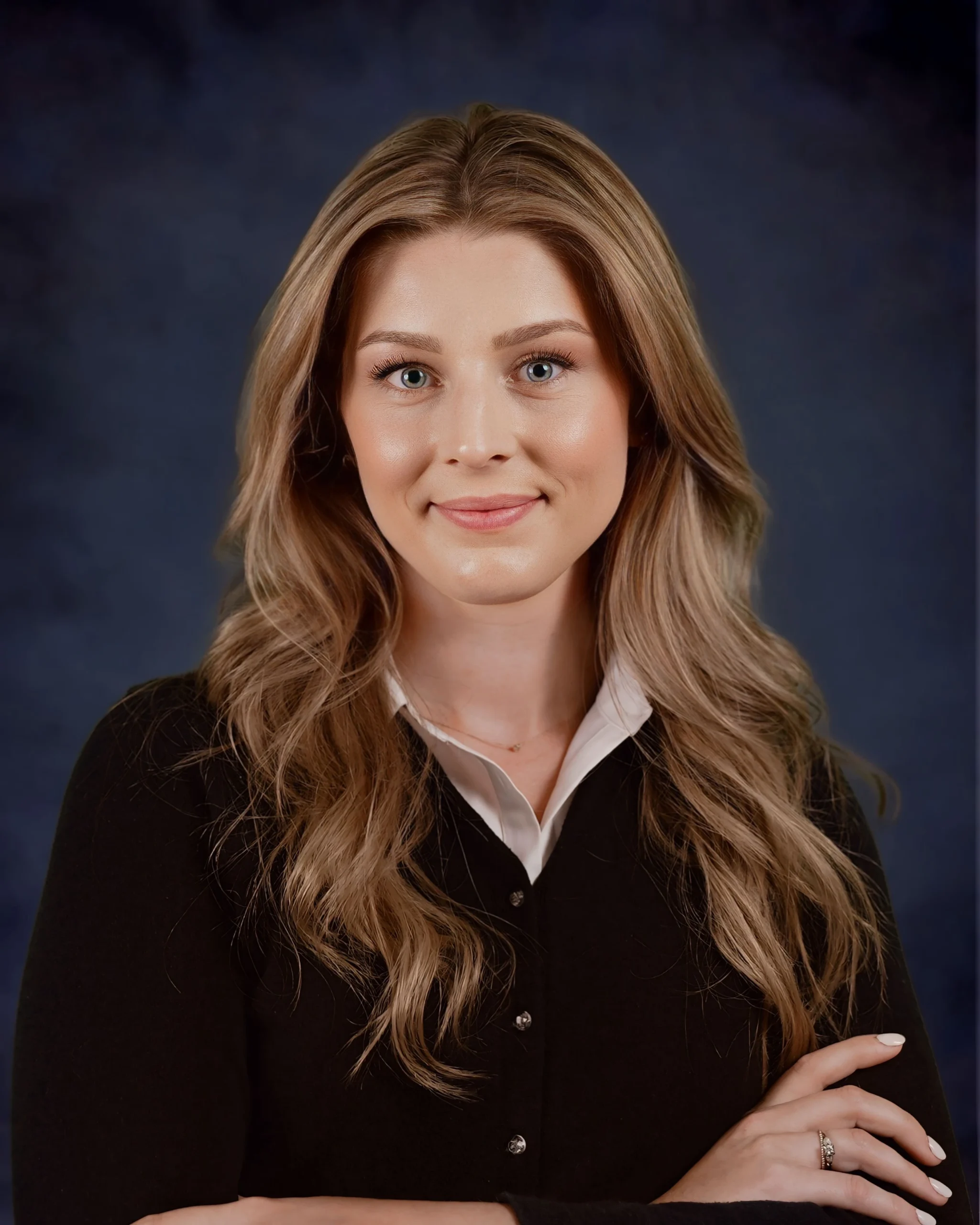 Professional headshot of Victoria, member of the real estate team.