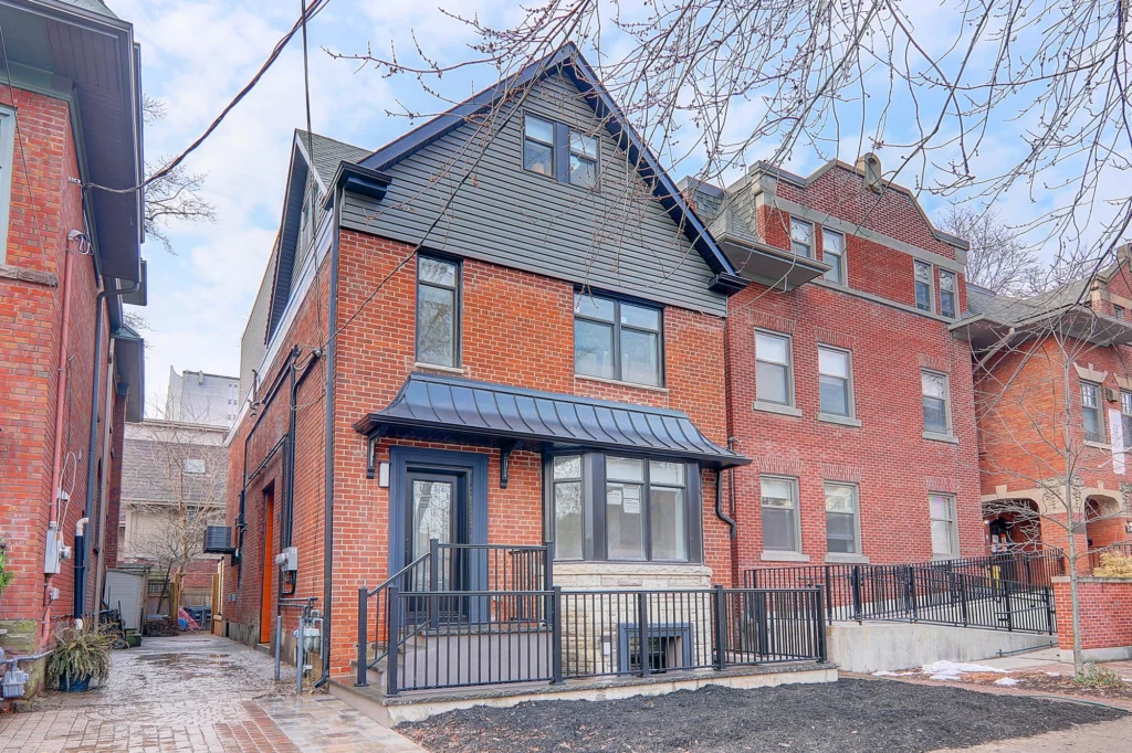 Renovated red-brick multiplex investment property in Toronto, part of LandLord’s design-build projects.