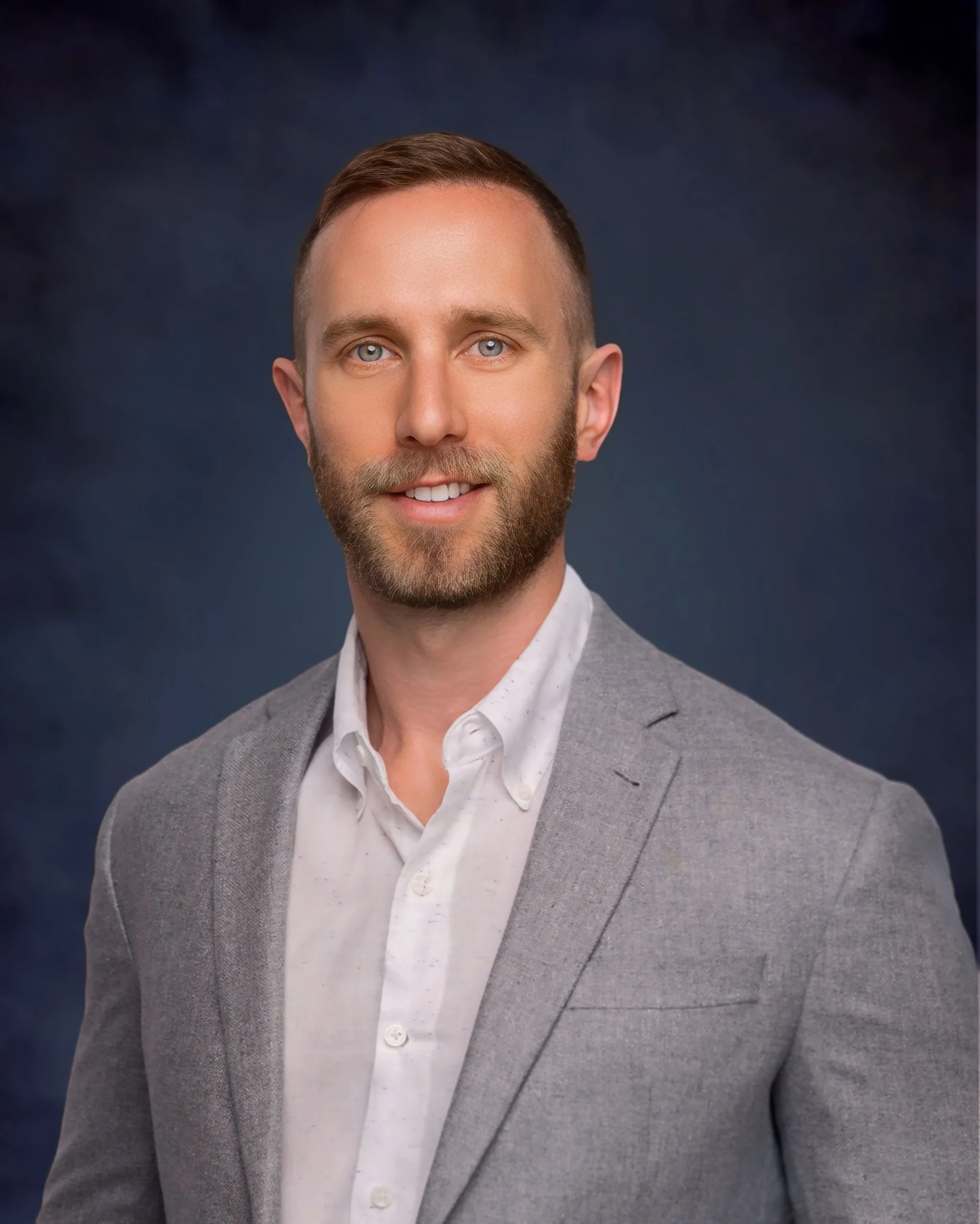 Professional headshot of Trevor, member of the real estate team.
